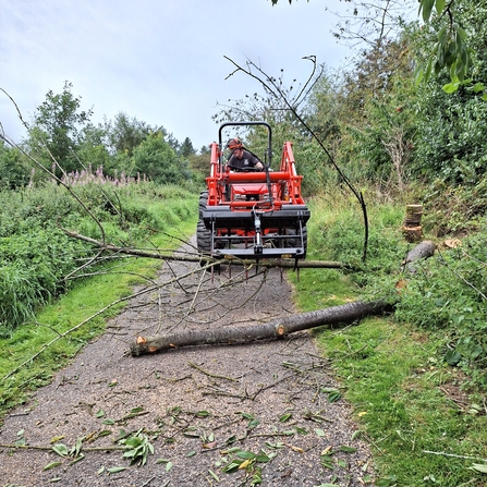 James clearing path with tractor