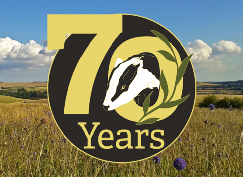 70 years wild logo over photo of Red Hill nature reserve