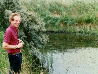 Barrie Wilkinson stood by a pond at Gibraltar Point