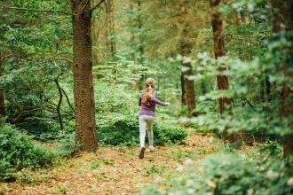 Children exploring woodland