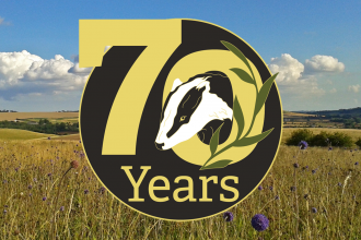 70 years wild logo over photo of Red Hill nature reserve