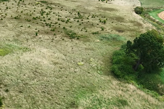 Drone shot of Hawthorpe showing neighbouring arable