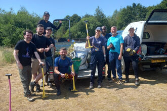 Volunteer work party helping control ragwort at Whisby