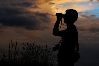 Binoculars at sunset