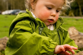 Toddler playing outside