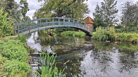 Humpback bridge over a lake at Doddington Hall
