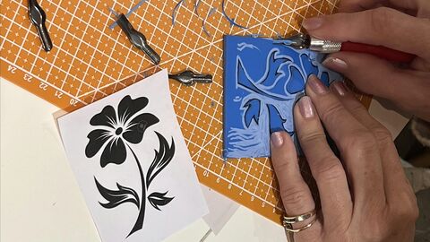 hands doing lino print