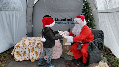 Santa giving present Santa's winter quest christmas