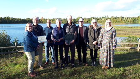 Members of the Saxilby Nature Project holding the Lincolnshire Environmental Award 2022