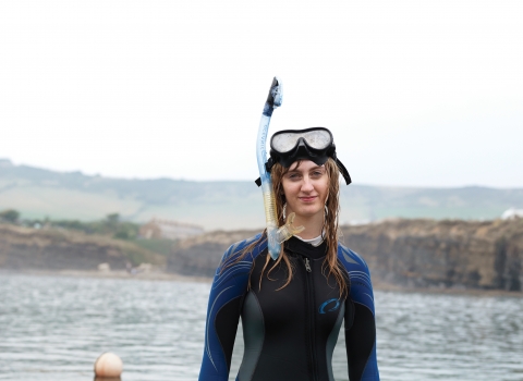 Heather in a wetsuit in the sea